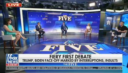 The Five sit in a room with a blue backdrop 