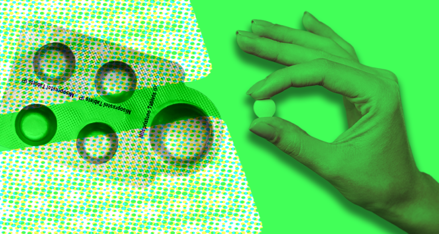 A packet of abortion medication next to a hand holding a medication tablet