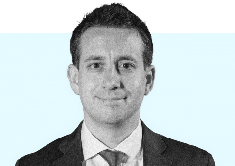 A still image of Matt Gertz. He is wearing a suitcoat and tie.